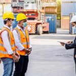 worker-team-meeting-and-training-logistics-and-transportation-business-containers-import-concept-the-supervisor-is-meeting-with-a-team-of-engineers-about-what-to-do-today-free-photo